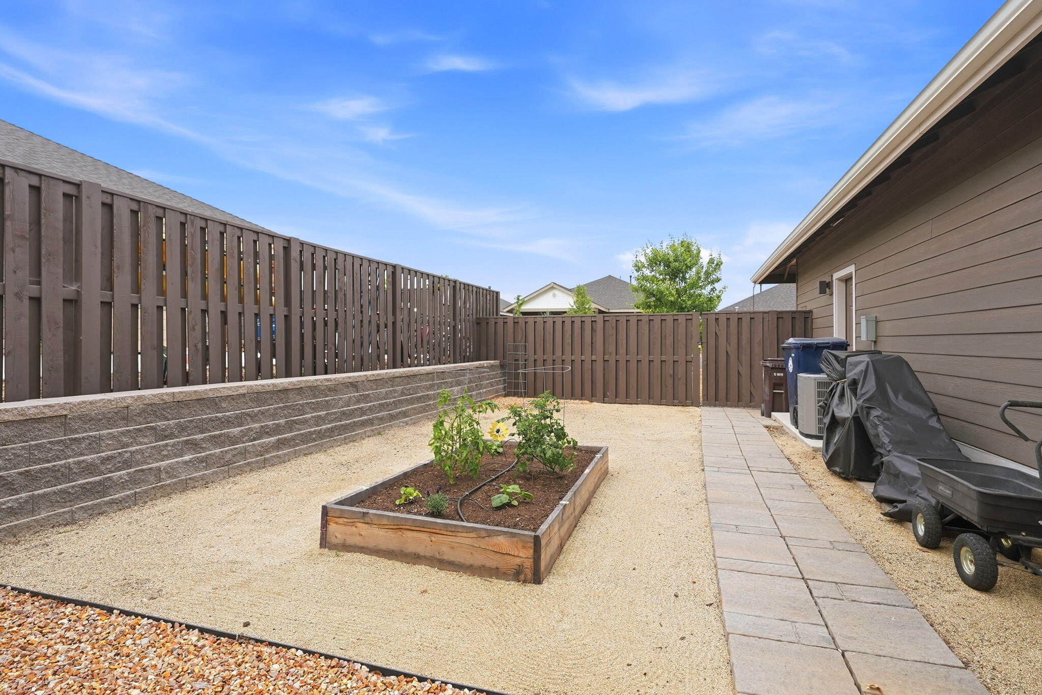 2714 Northwest 23rd Street Redmond, OR 97756 - Photo 46 of 57 a wooden bench sitting in front of a building