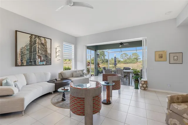 a bathroom with a granite countertop double vanity sink a mirror and a bathtub