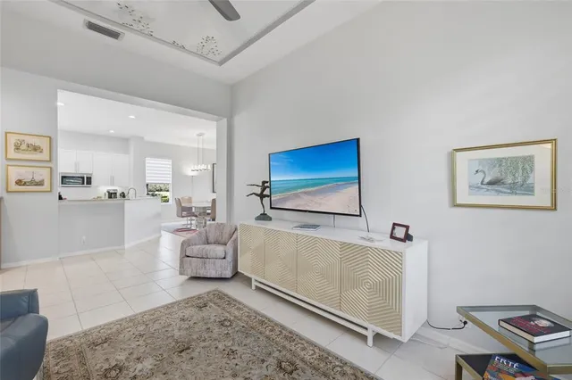 a bedroom with a bed mirror and a window