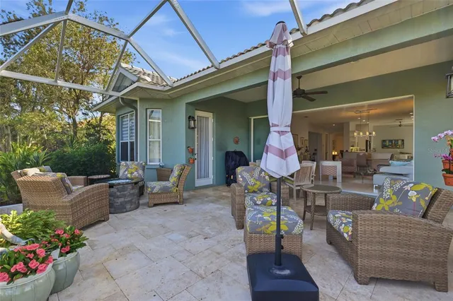 a front view of a house with a garden and trees
