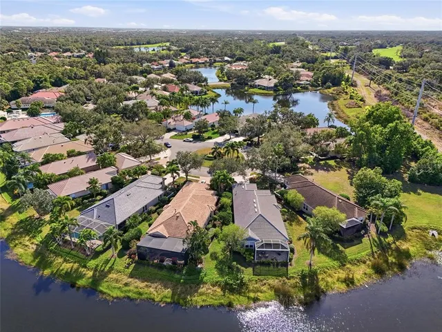 a living room with lots of furniture and a large window