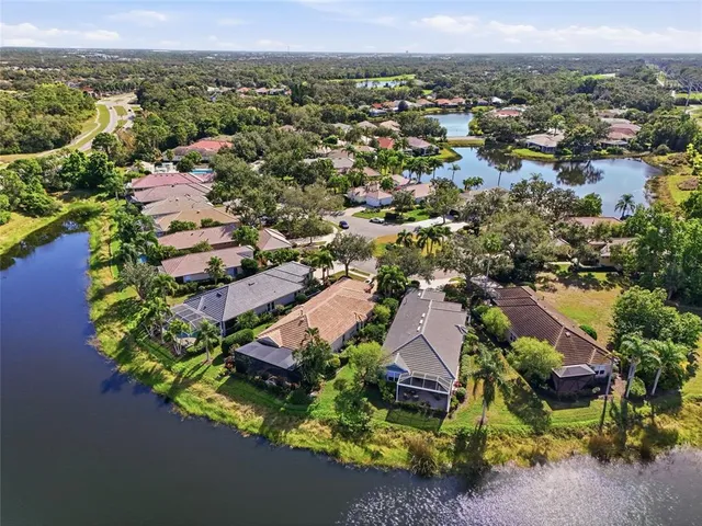 a view of a balcony with wooden floor and fence