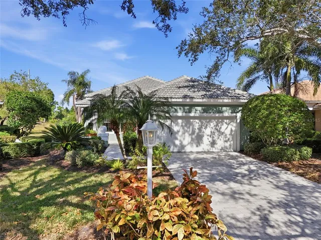 a living room with furniture a piano and a window