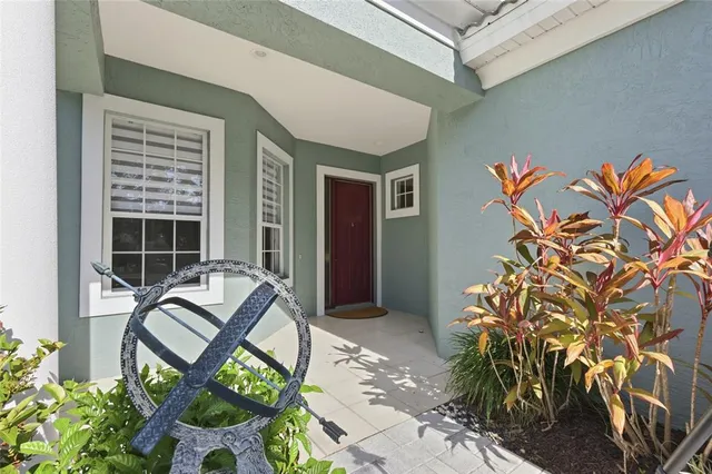a living room with furniture a window and stainless steel appliances