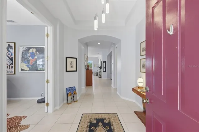 a kitchen with sink a stove and cabinets