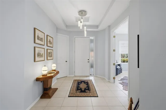 a bathroom with a granite countertop sink mirror and a large window
