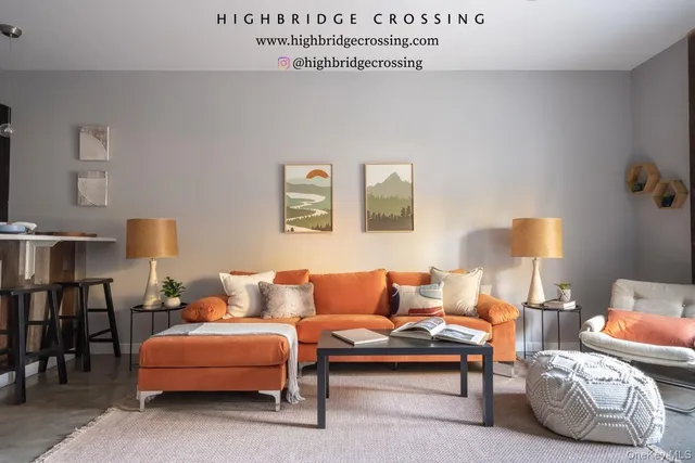 a living room with furniture and a lamp