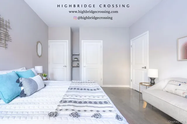 a bedroom with a bed and a white couch