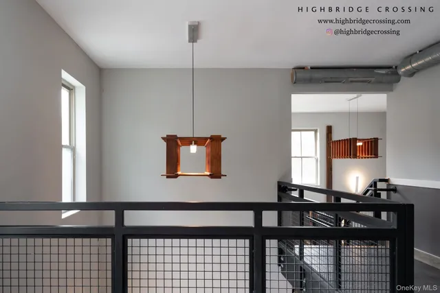 a living room with furniture and stairs