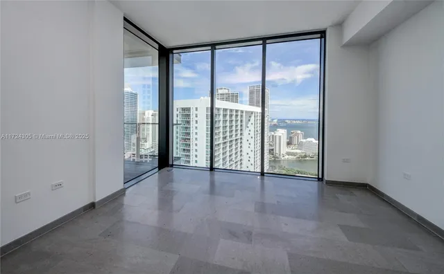 a bathroom with a granite countertop sink a toilet a mirror and bathtub
