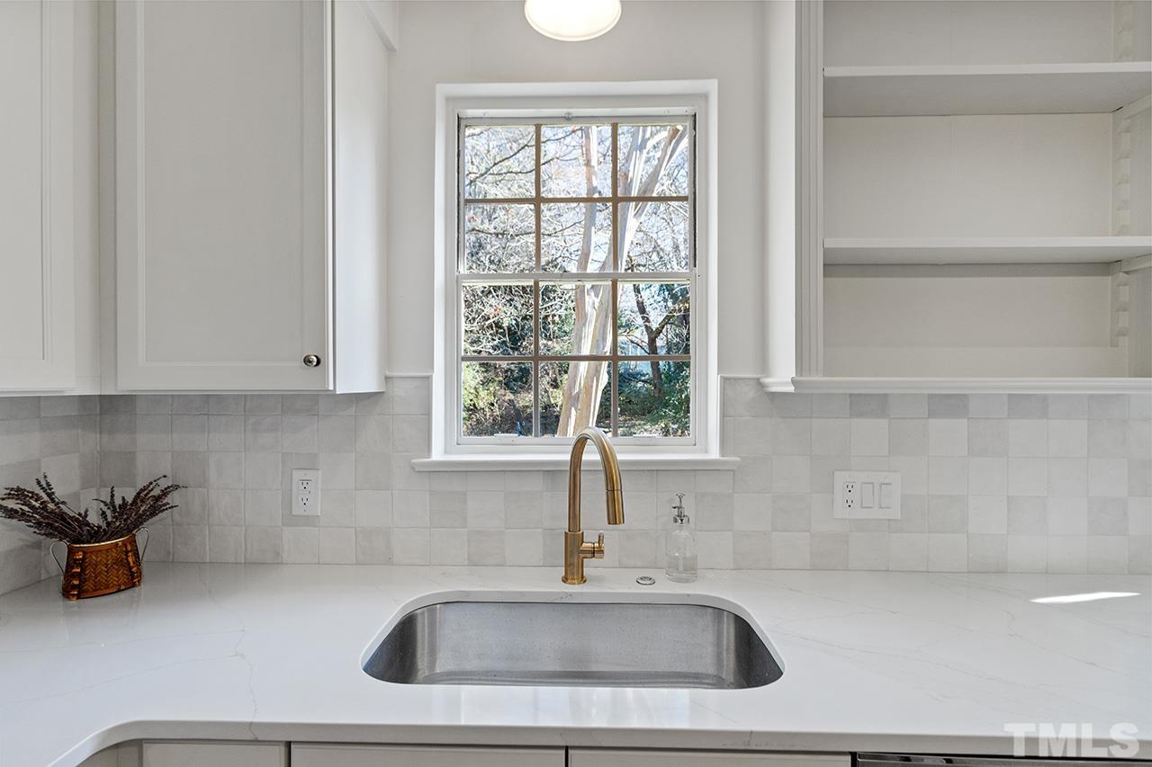 704 Dixie Trail Raleigh, NC 27607 - Photo 18 of 31 a kitchen with a sink and a window