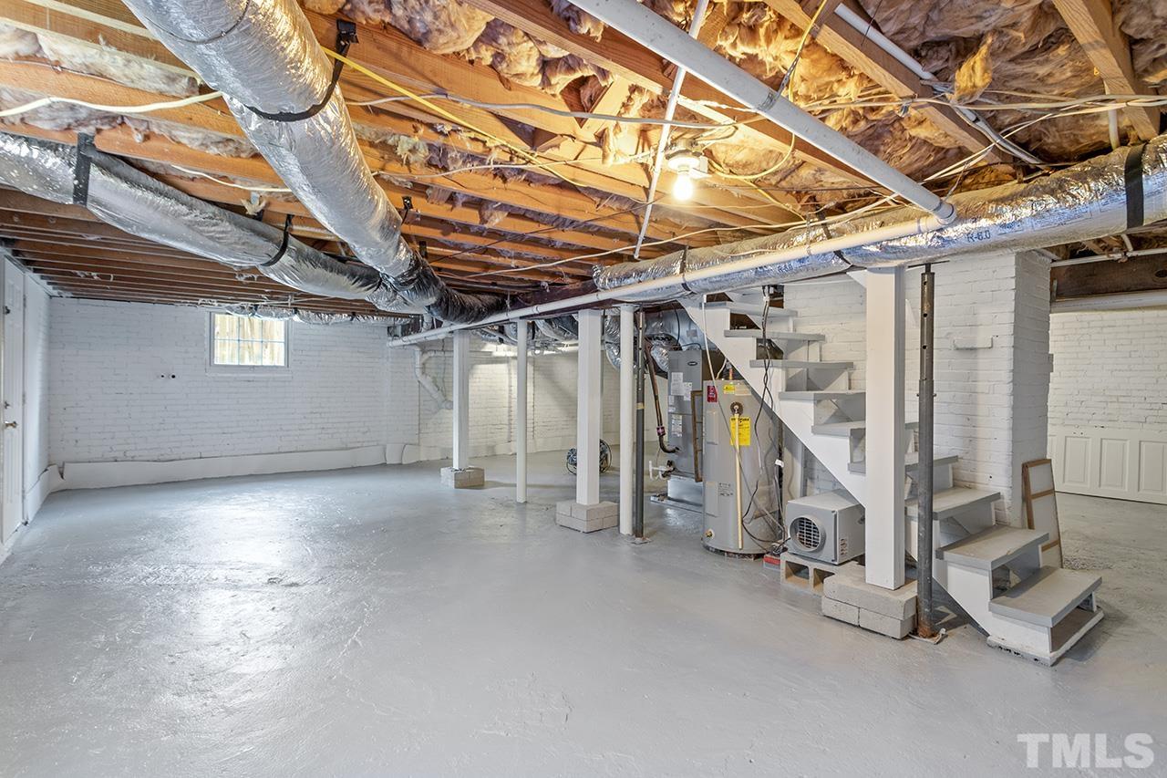 704 Dixie Trail Raleigh, NC 27607 - Photo 28 of 31 a view of an empty room with wooden floor