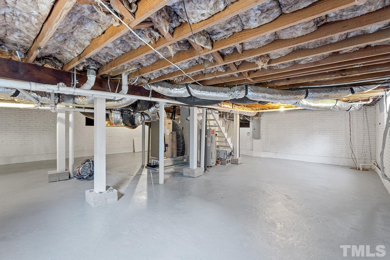 704 Dixie Trail Raleigh, NC 27607 - Photo 29 of 31 a view of empty room with wooden walls