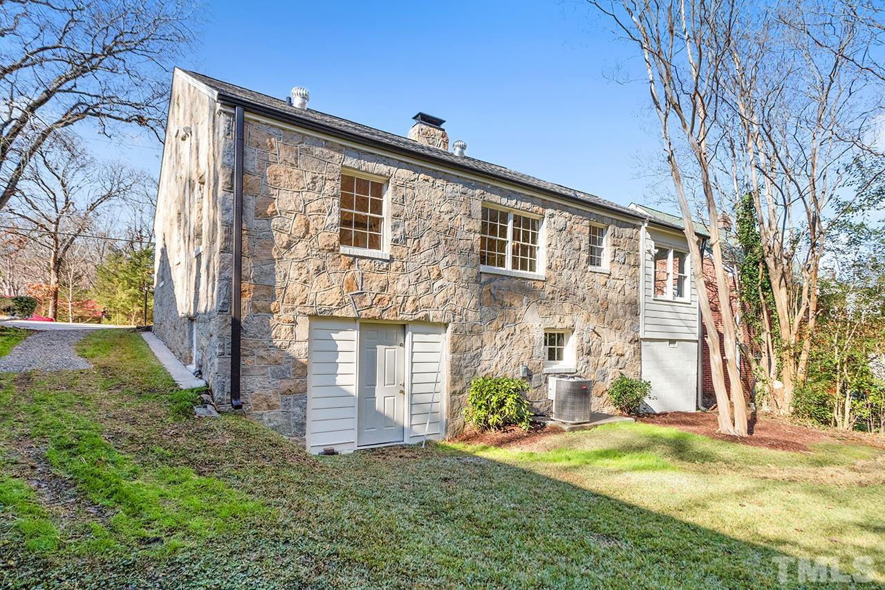704 Dixie Trail Raleigh, NC 27607 - Photo 4 of 31 front view of a house with a yard