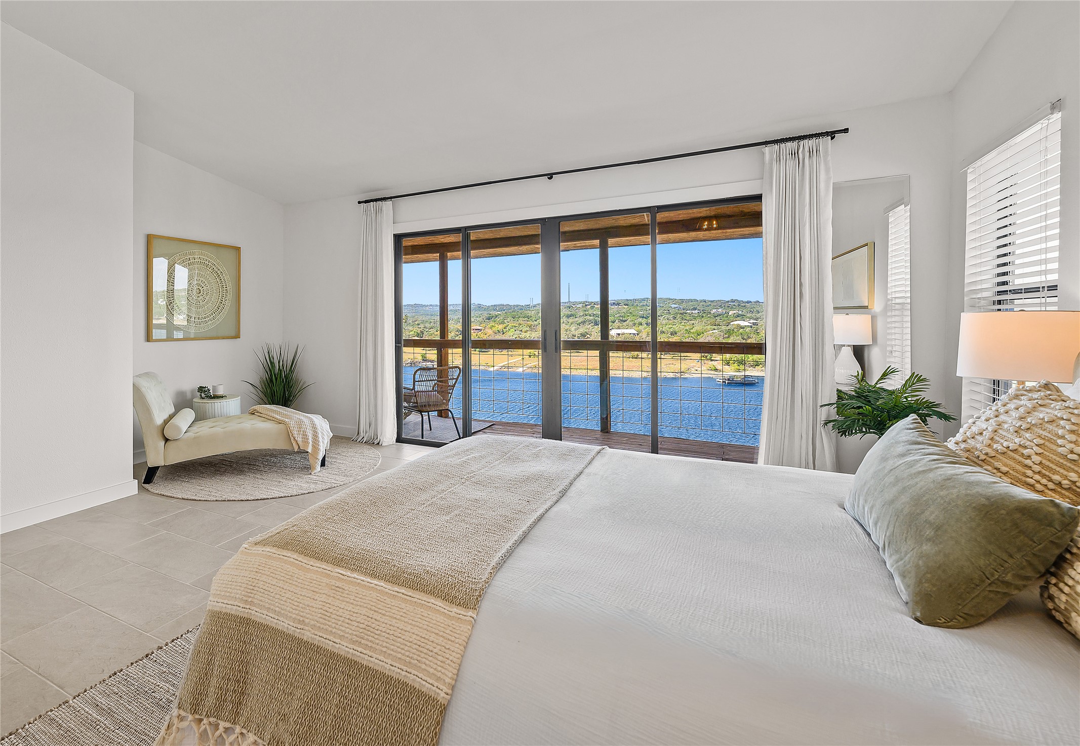 19645 Lakehurst Loop Spicewood, TX 78669 - Photo 27 of 40 Tiled bedroom featuring access to exterior and a water view