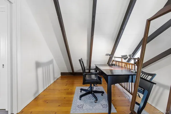 a view of a hallway with seating area