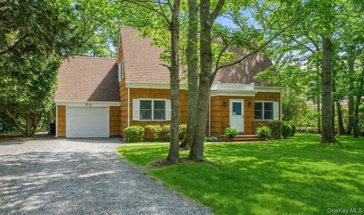 3 Foster Avenue Hampton Bays, NY 11946 - Photo 20 of 20 front view of a house with a yard