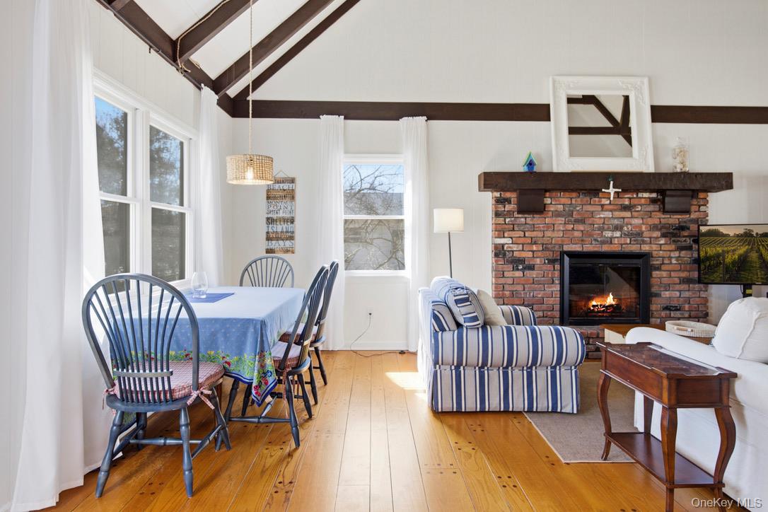 3 Foster Avenue Hampton Bays, NY 11946 - Photo 8 of 20 a view of a livingroom with furniture window and wooden floor