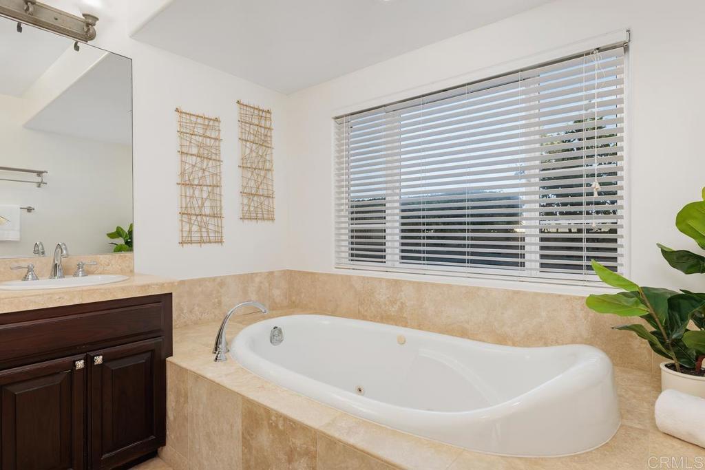 6456 Franciscan Road Carlsbad, CA 92011 - Photo 13 of 43 a bathroom with a bathtub and a sink