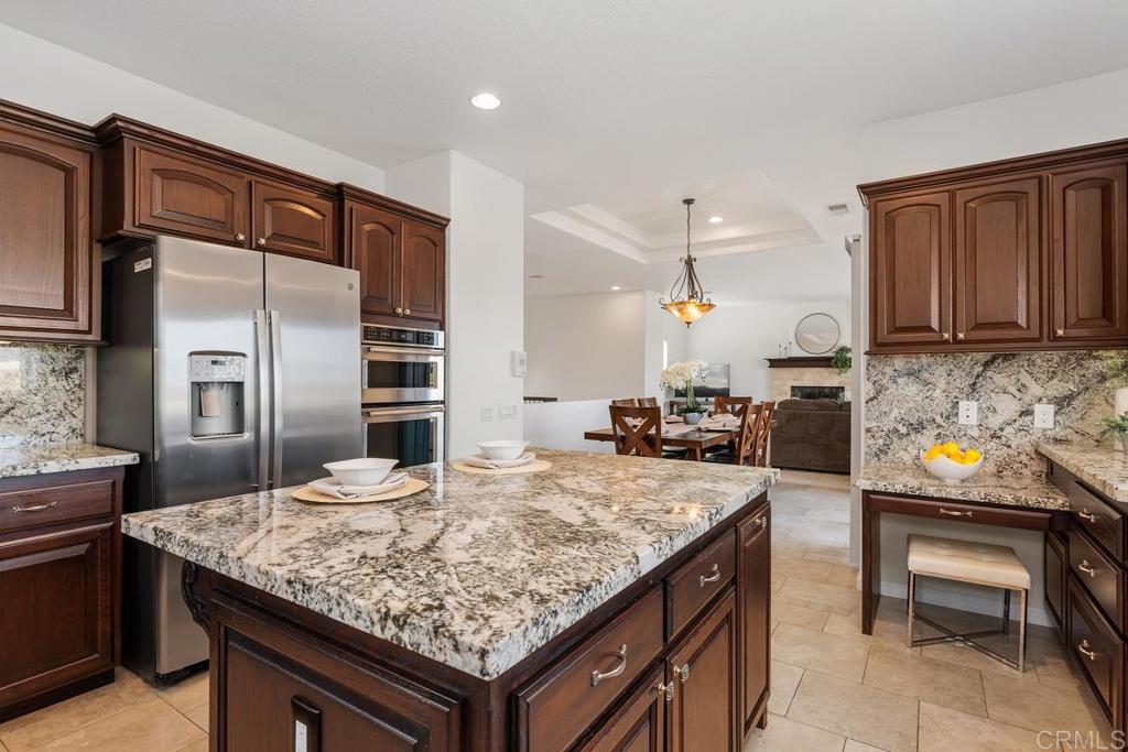 6456 Franciscan Road Carlsbad, CA 92011 - Photo 19 of 43 a kitchen with a stove and a refrigerator