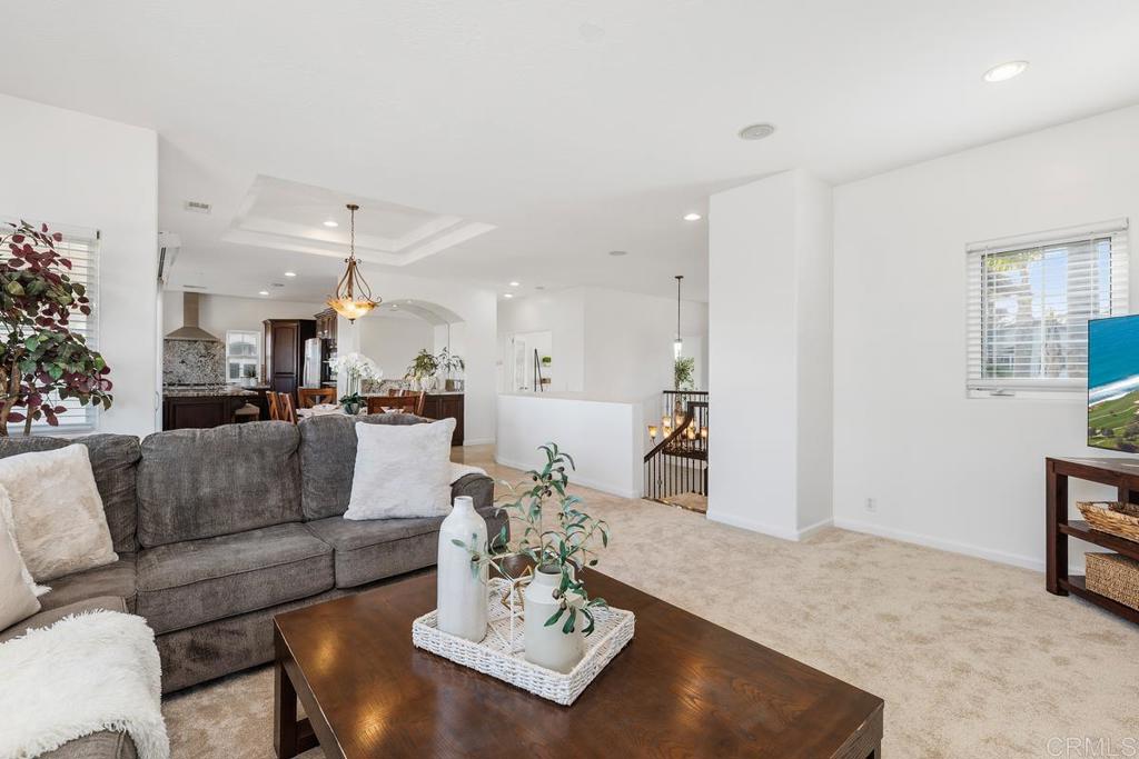 6456 Franciscan Road Carlsbad, CA 92011 - Photo 24 of 43 a living room with furniture and a dining table