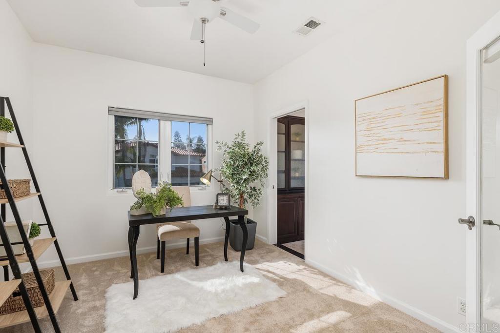 6456 Franciscan Road Carlsbad, CA 92011 - Photo 26 of 43 a view of a workspace with furniture and a potted plant