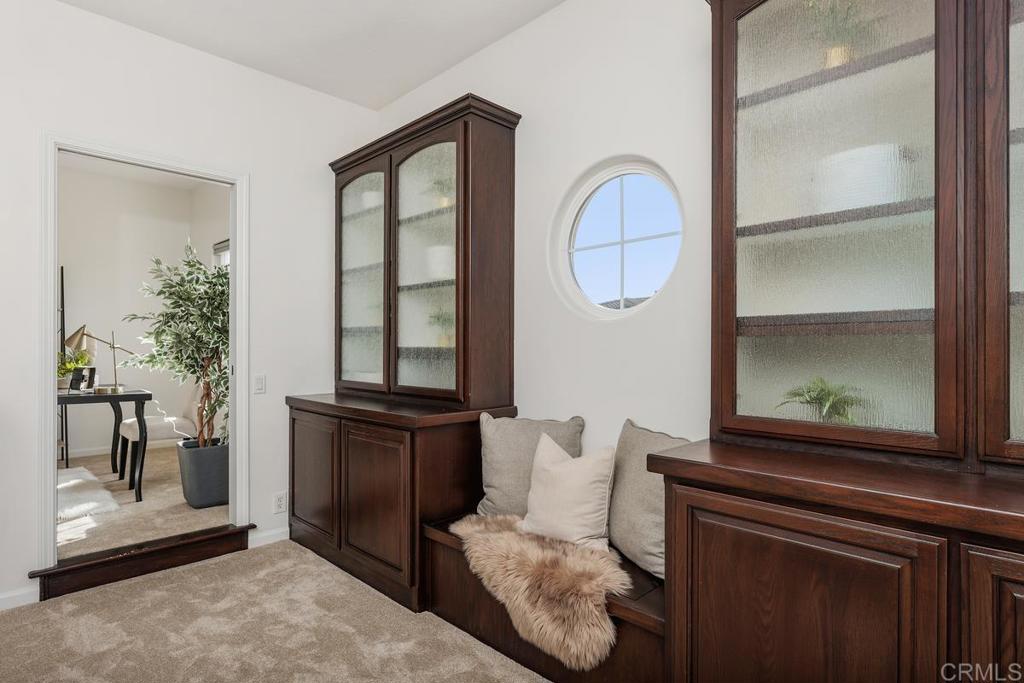 6456 Franciscan Road Carlsbad, CA 92011 - Photo 27 of 43 a living room with furniture and a window