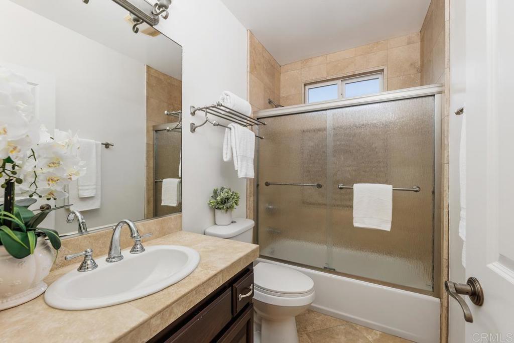 6456 Franciscan Road Carlsbad, CA 92011 - Photo 28 of 43 a bathroom with a sink toilet and shower