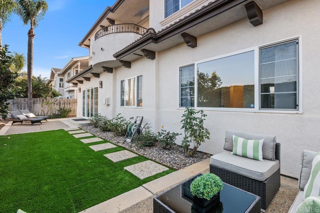 6456 Franciscan Road Carlsbad, CA 92011 - Photo 37 of 43 a view of a patio with couches table and chairs and potted plants