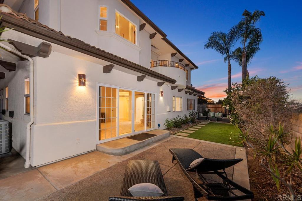 6456 Franciscan Road Carlsbad, CA 92011 - Photo 4 of 43 a front view of a house with garden