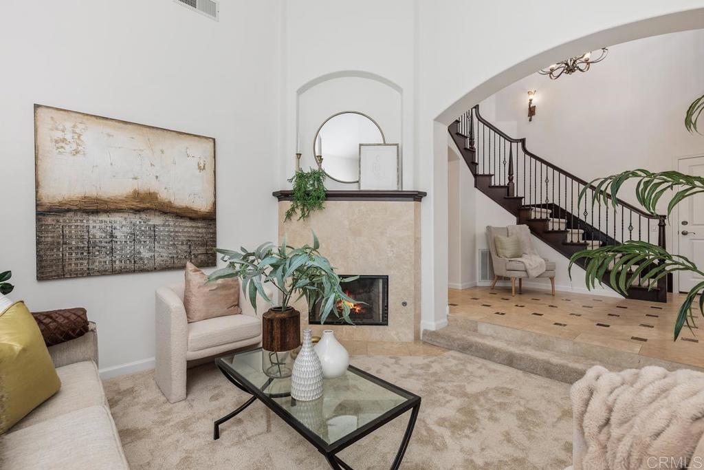 6456 Franciscan Road Carlsbad, CA 92011 - Photo 9 of 43 a living room with furniture and a fireplace