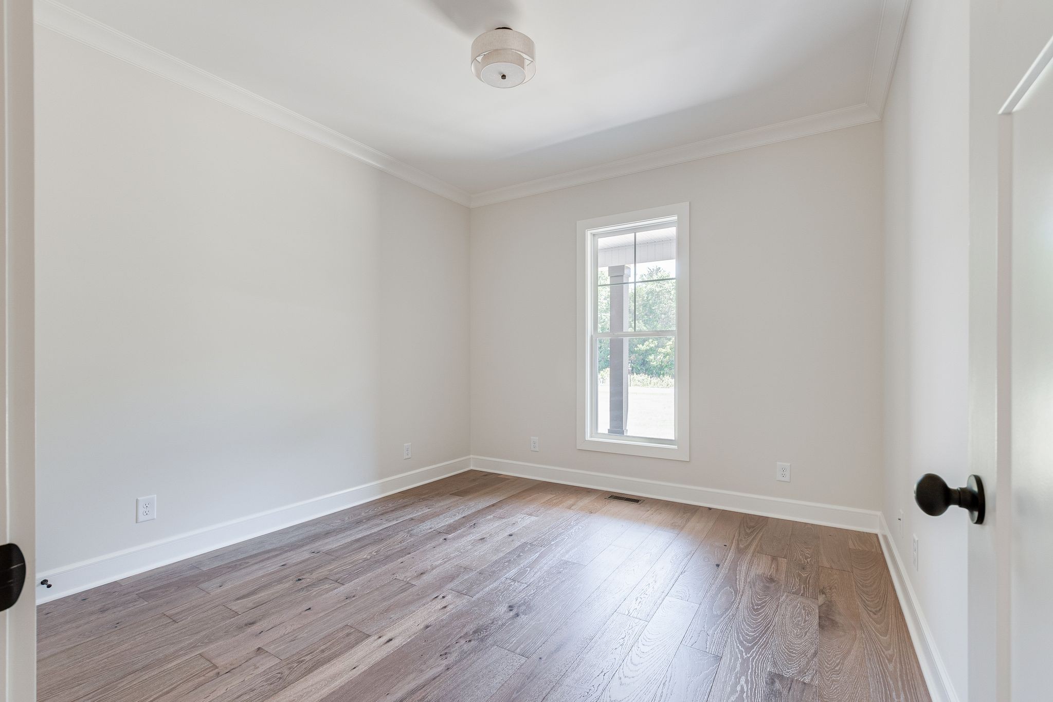 1563 Phillips Road Lebanon, TN 37087 - Photo 21 of 33 wooden floor in an empty room with a window