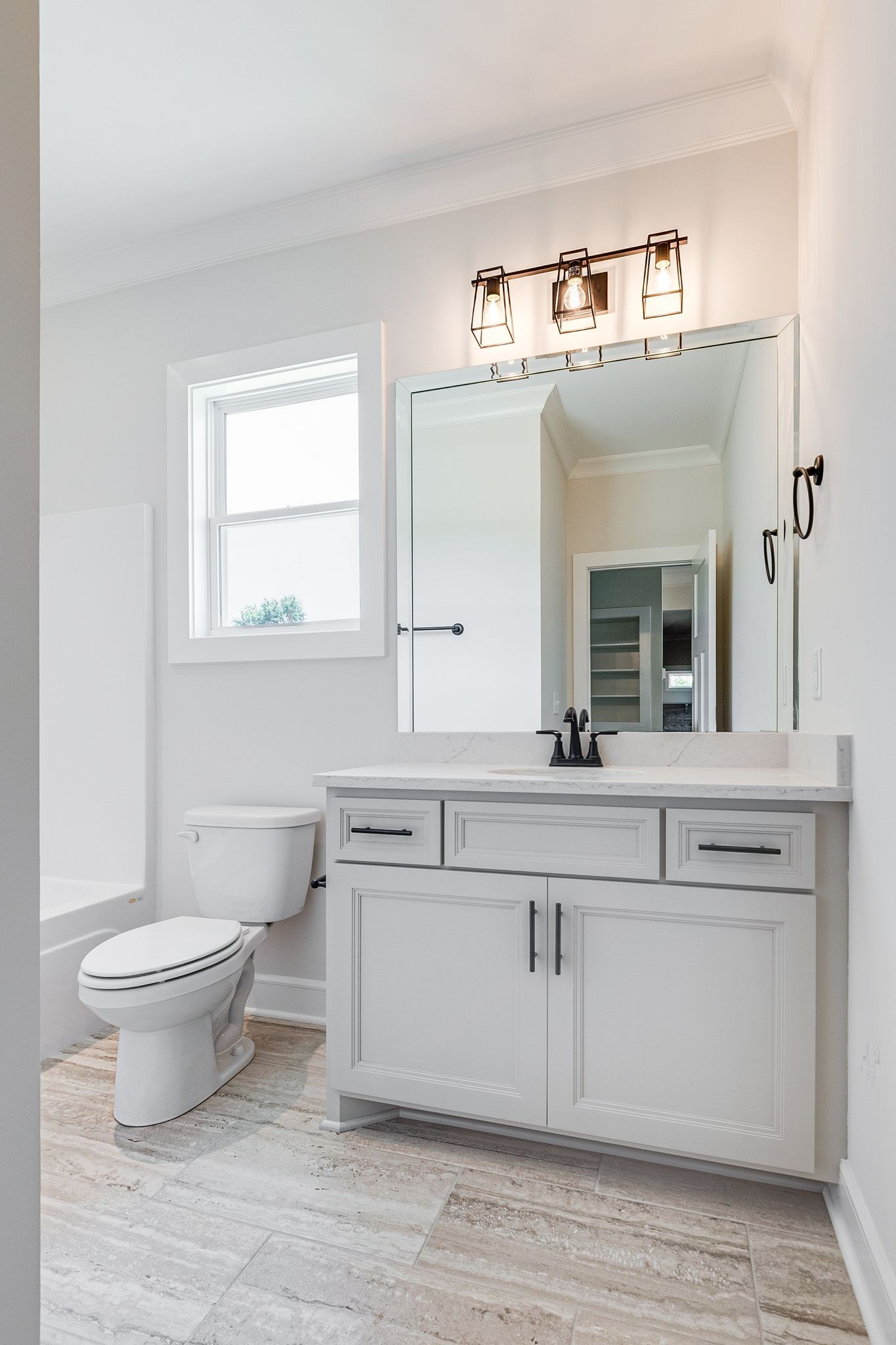 1563 Phillips Road Lebanon, TN 37087 - Photo 23 of 33 a bathroom with a toilet sink and mirror