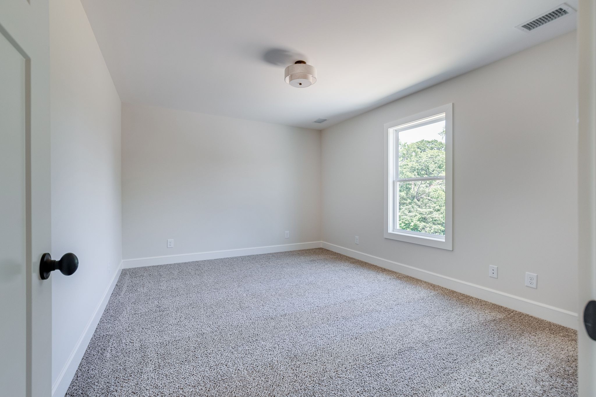 1563 Phillips Road Lebanon, TN 37087 - Photo 28 of 33 an empty room with a white cabinet and a window