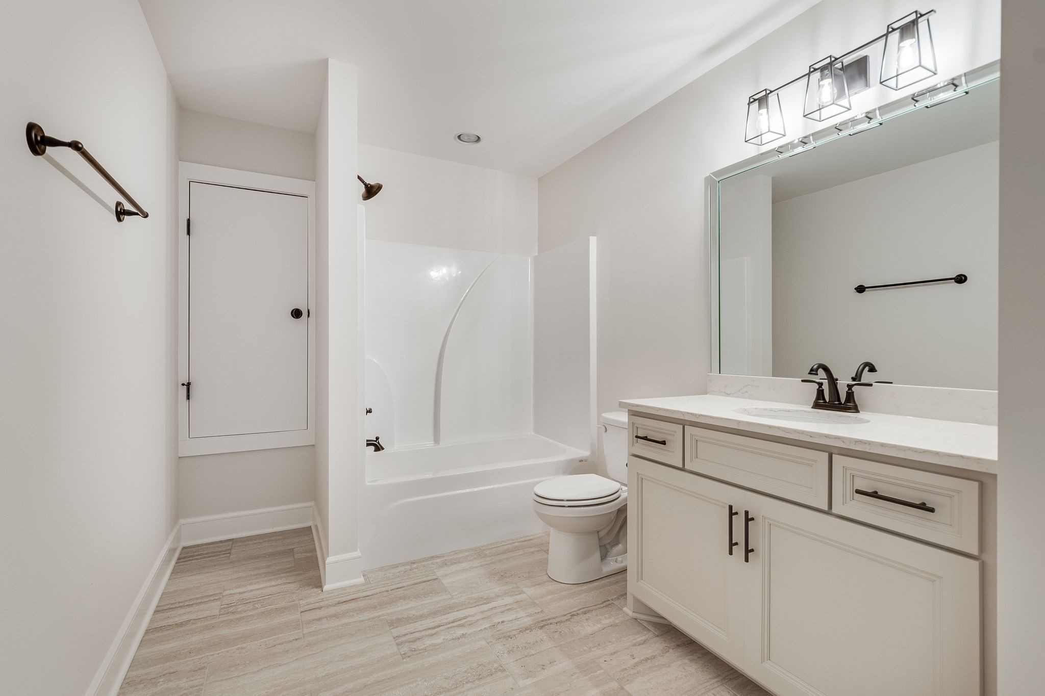 1563 Phillips Road Lebanon, TN 37087 - Photo 29 of 33 a bathroom with a toilet sink a mirror and vanity
