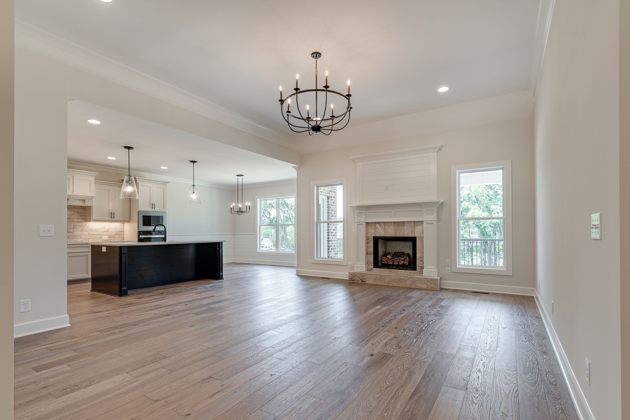 1563 Phillips Road Lebanon, TN 37087 - Photo 5 of 33 a view of an empty room and kitchen with wooden floor