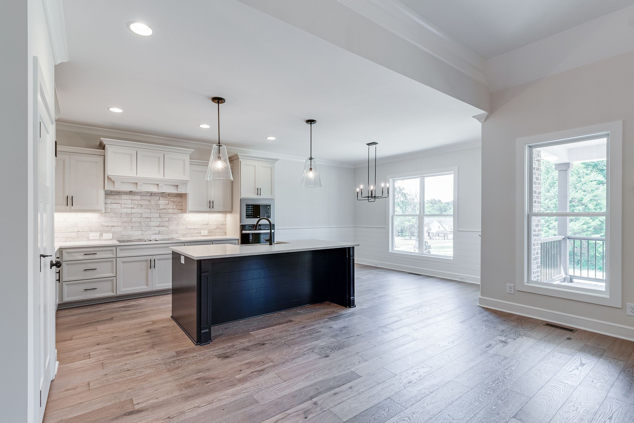 1563 Phillips Road Lebanon, TN 37087 - Photo 8 of 33 a large kitchen with stainless steel appliances kitchen island granite countertop a stove a sink and a wooden floors
