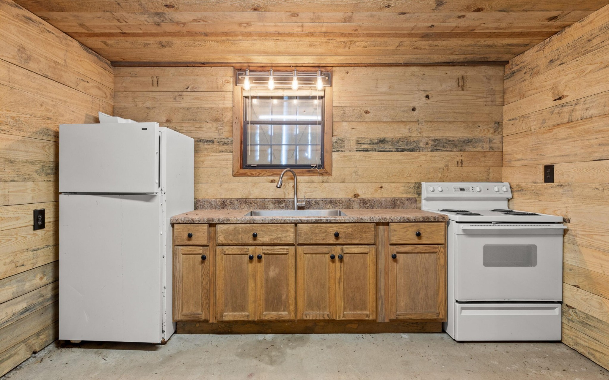 36 Still Hollow Road Menlo, GA 30731 - Photo 36 of 63 a kitchen with granite countertop a sink stove and refrigerator