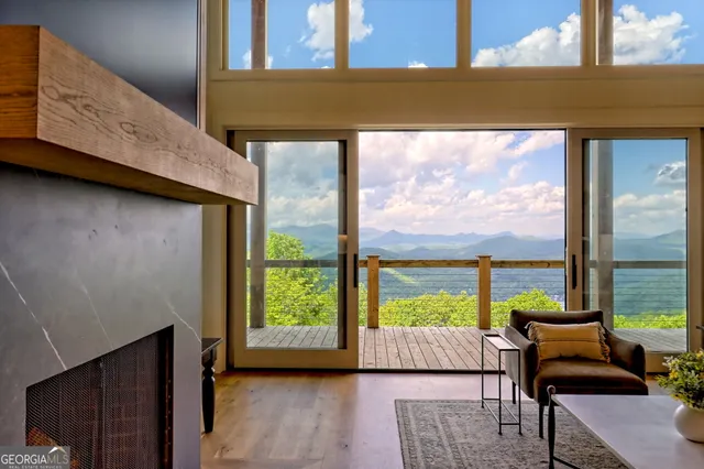 a view of a patio with table and chairs and wooden floor