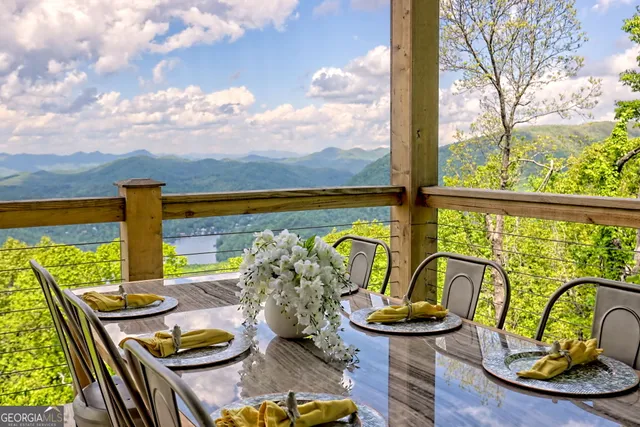 a view of a balcony with lake view and a ocean view
