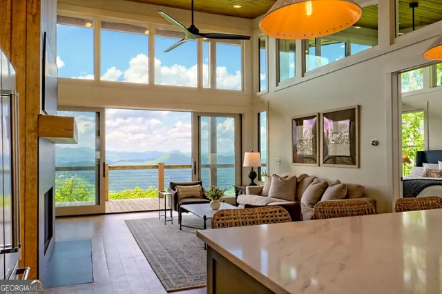 an aerial view of residential house with outdoor space and trees around