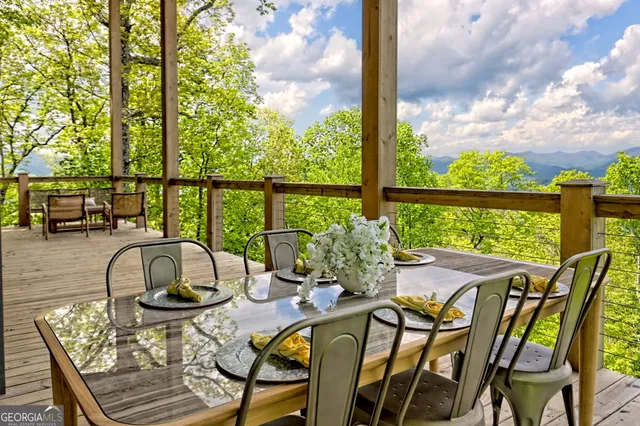 a view of a patio with a dining table and chairs