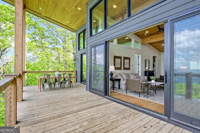 a large bed sitting in a bedroom next to a window