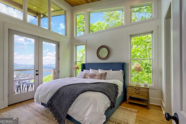 a bedroom with a bed and a night stand