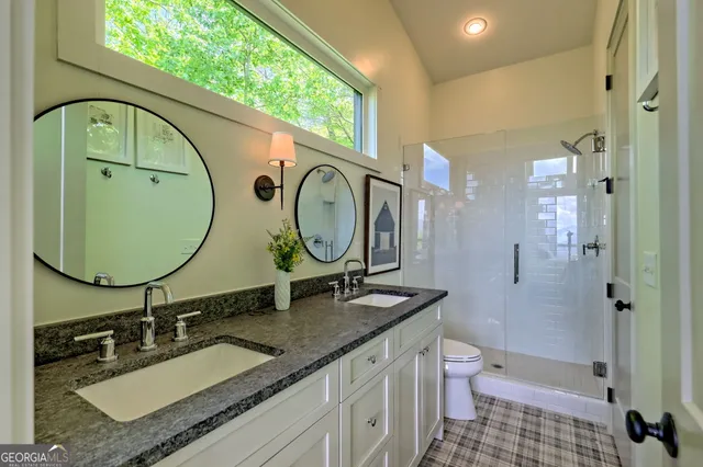 a bathroom with a sink and a large mirror