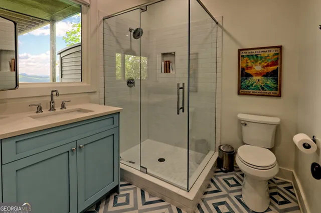 an aerial view of a house with pool yard and outdoor seating