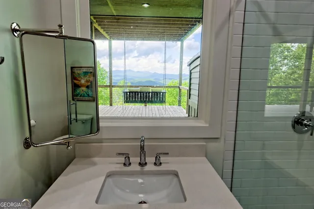 a view of a house with backyard porch and sitting area