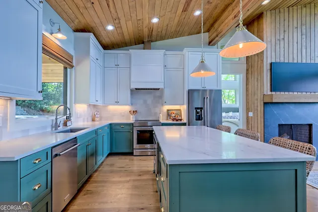 a kitchen with a sink and a large window