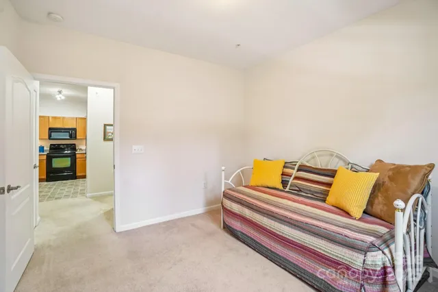 a bedroom with a bed and couch