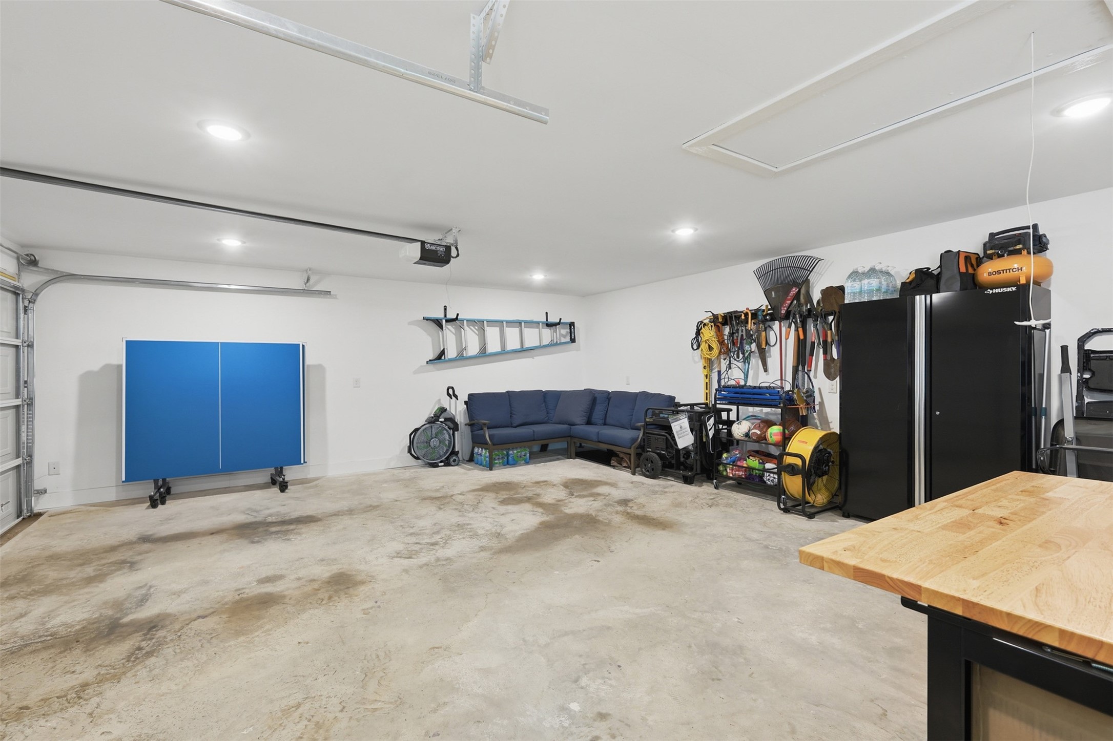 6126 Hickorycrest Drive Spring, TX 77389 - Photo 27 of 50 Spacious garage with room for parking, storage, and a work or hobby area.
